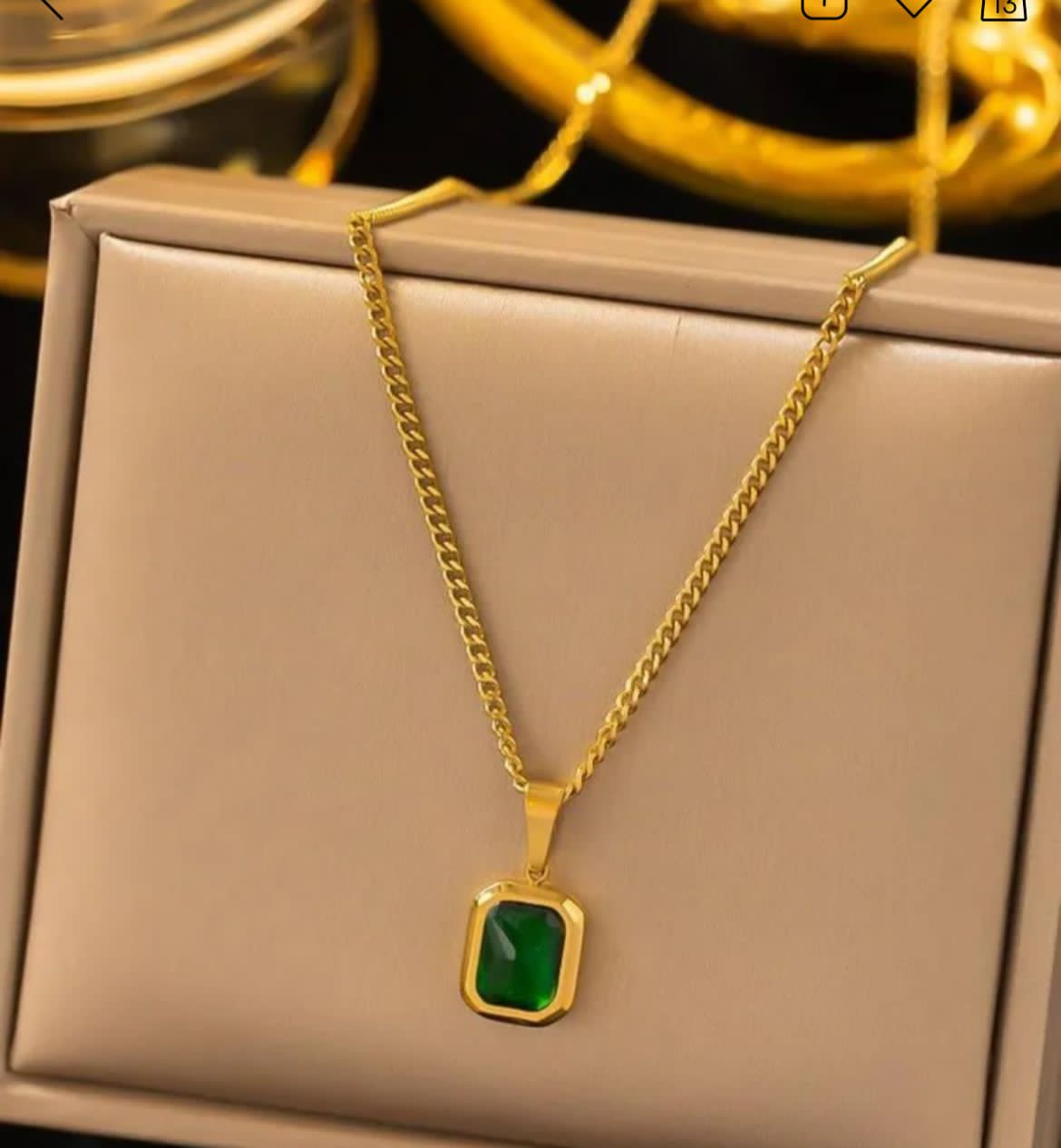 Gold chain with green pendant